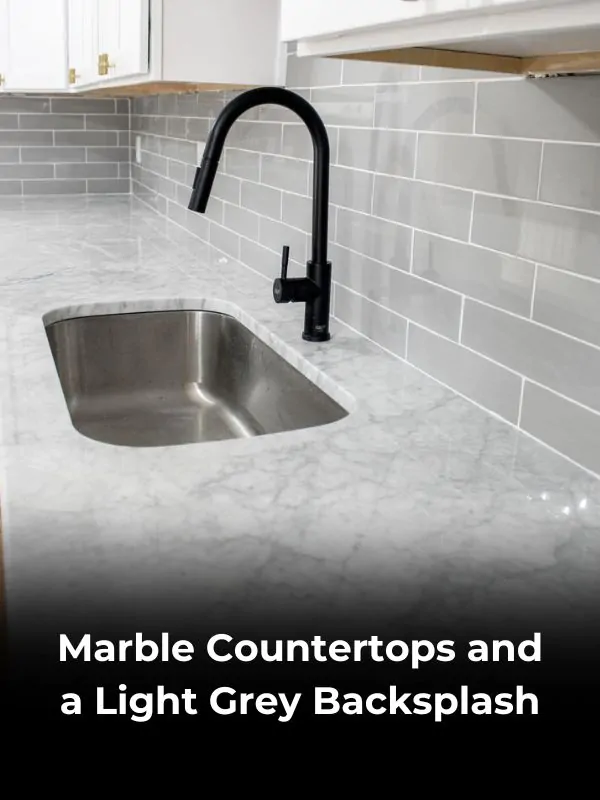 Marble Countertops and a Light Grey Backsplash (1)